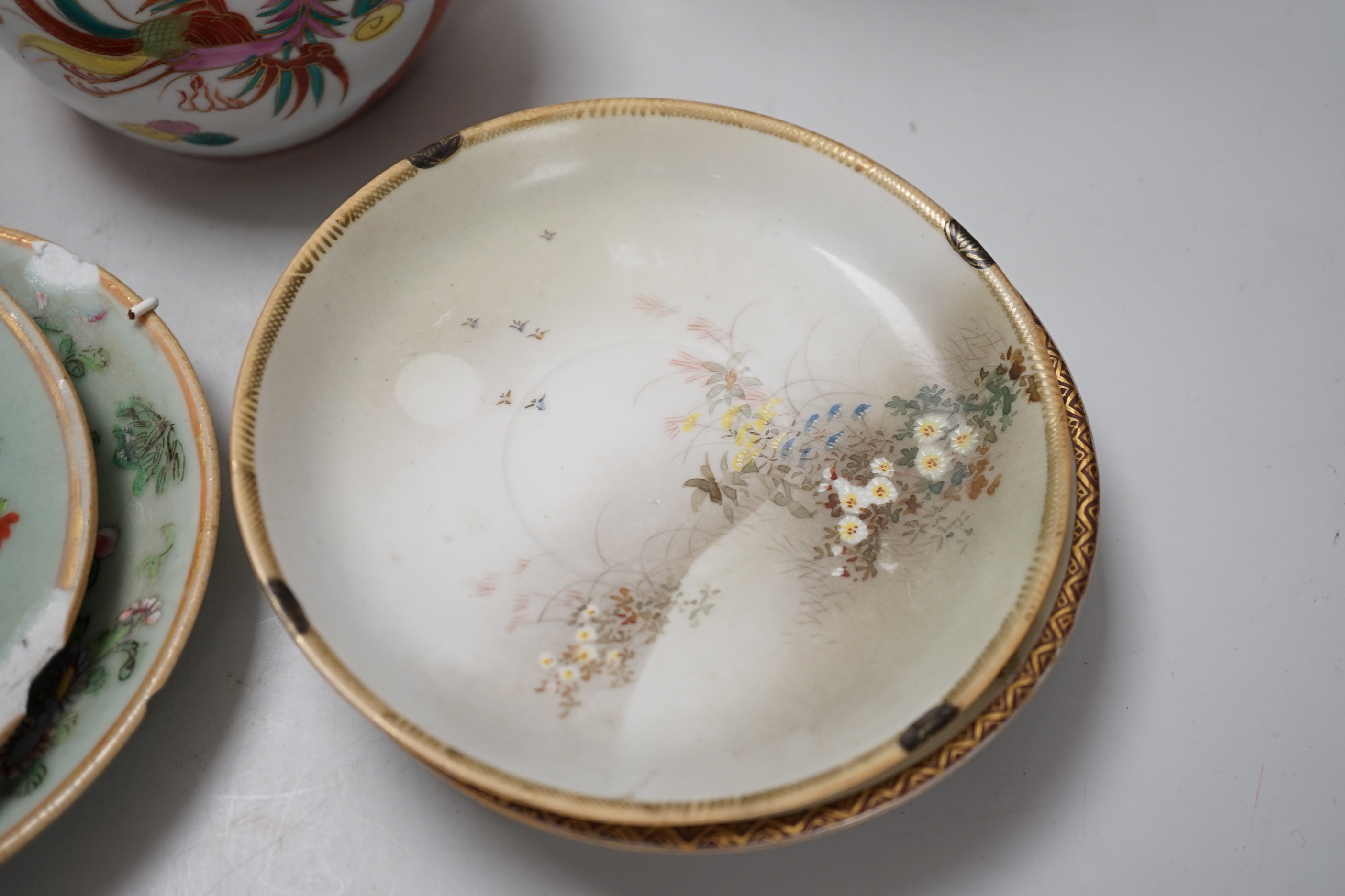Three Chinese blanc de chine figures, two famille vert plates, a Japanese jar and three eggshell saucers